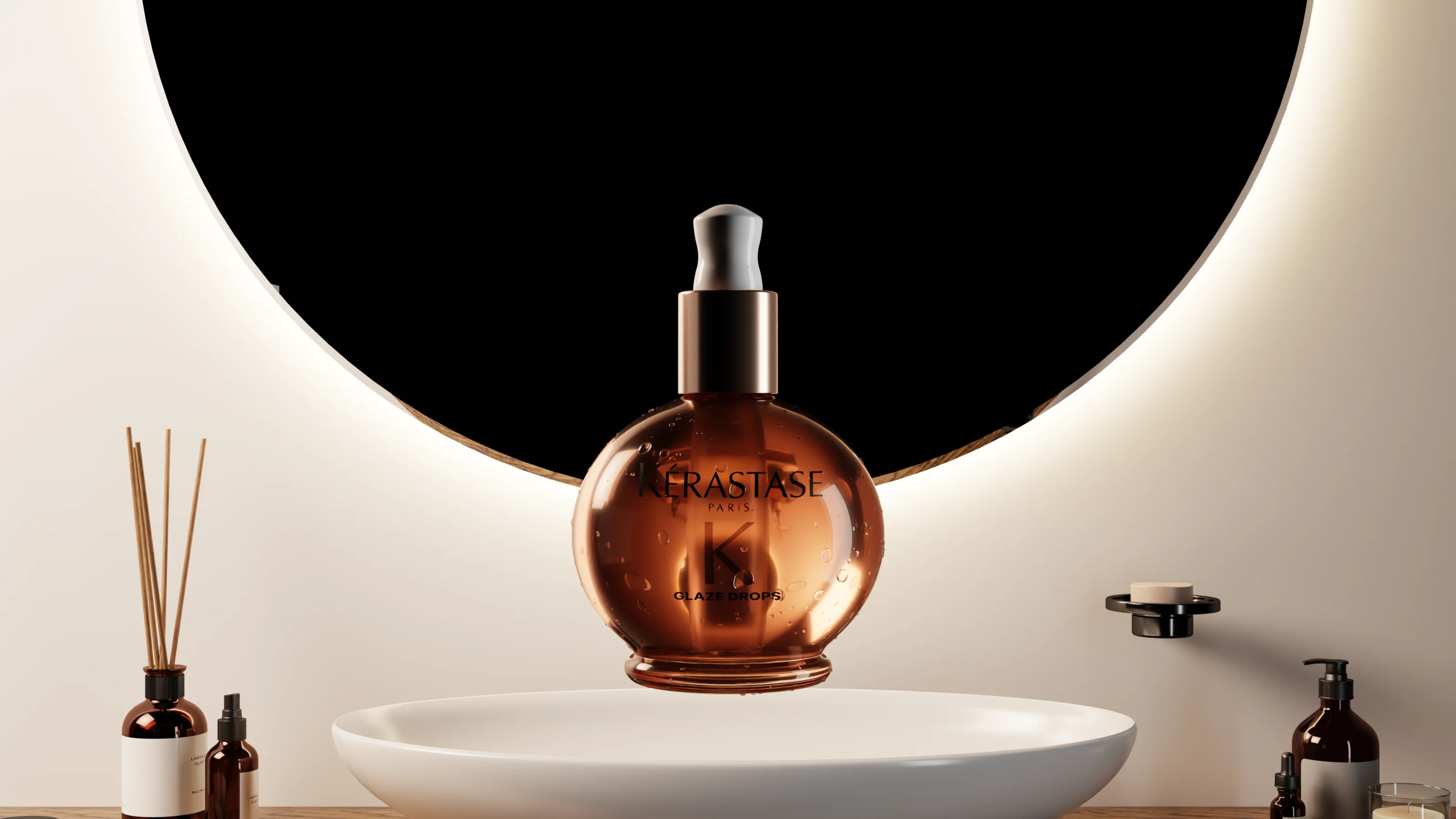 Amber hair oil bottle in front of a round backlit mirror