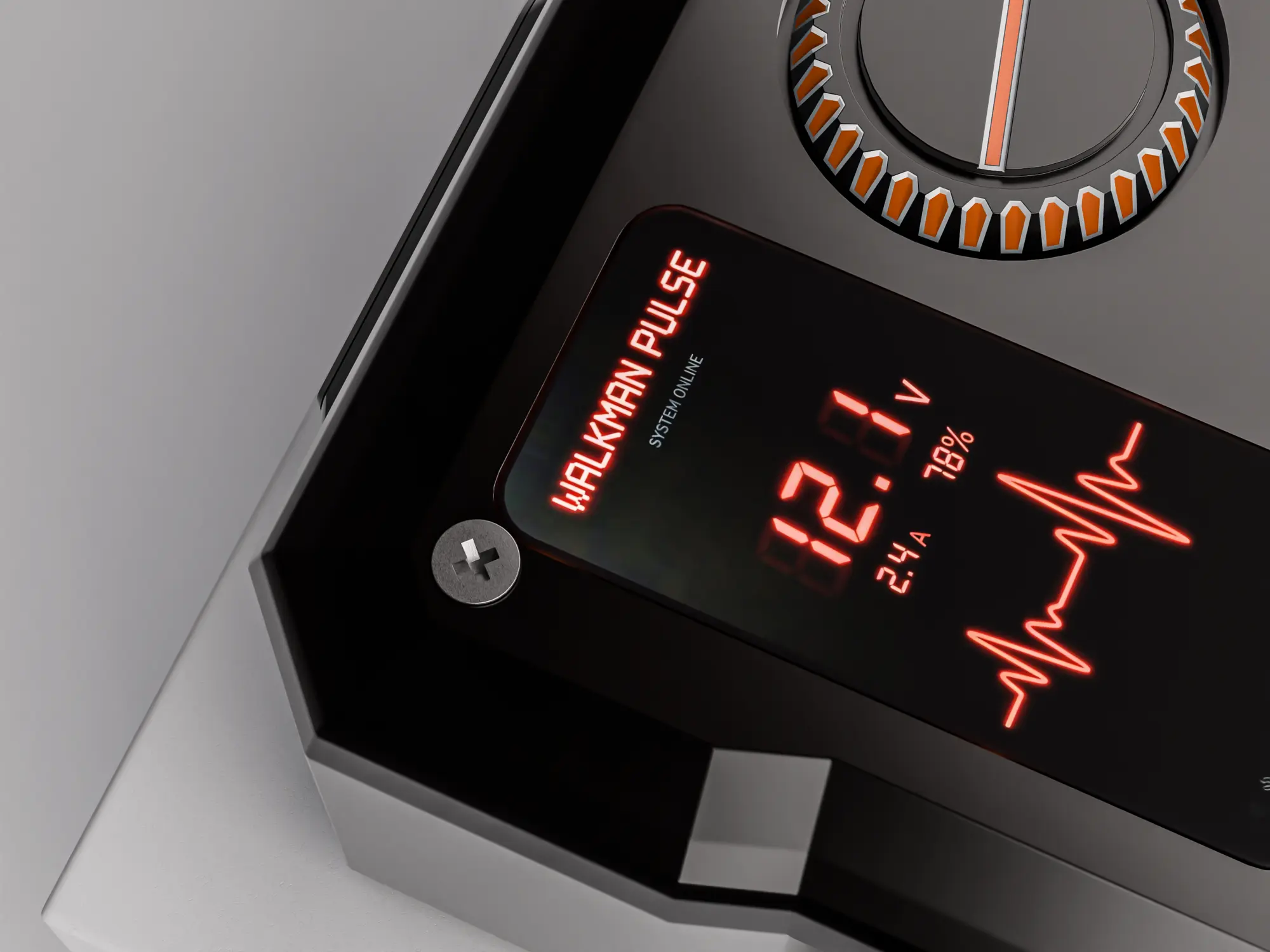 Close view of the display, dial and corner screw